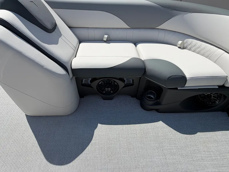 Slide: The Image of Sleek, modern seating with gray and white upholstery on a boat. - 8