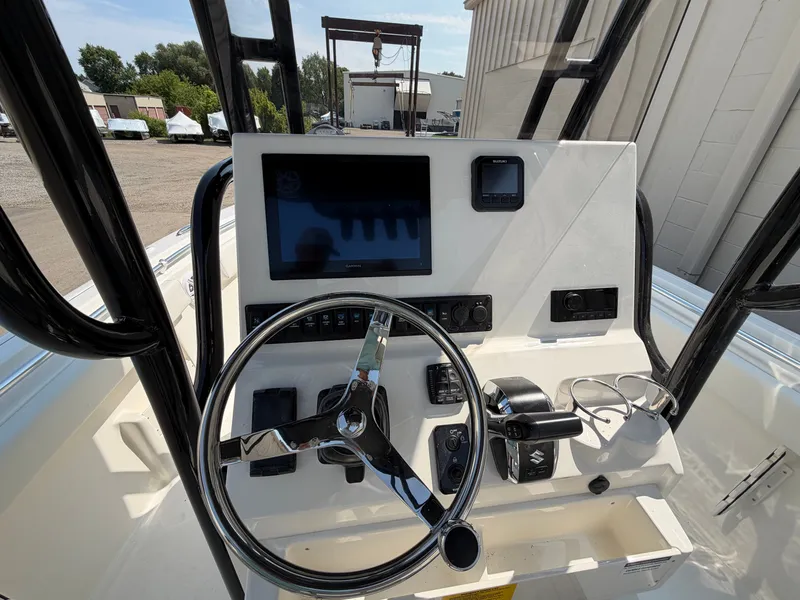 Slide: The Image of The image shows the helm of a Key West 239 FS boat with modern instruments. - 8
