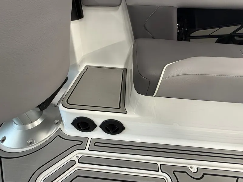 Slide: The Image of The image shows the interior of a 2026 Moomba Tykon boat with gray upholstery. - 23
