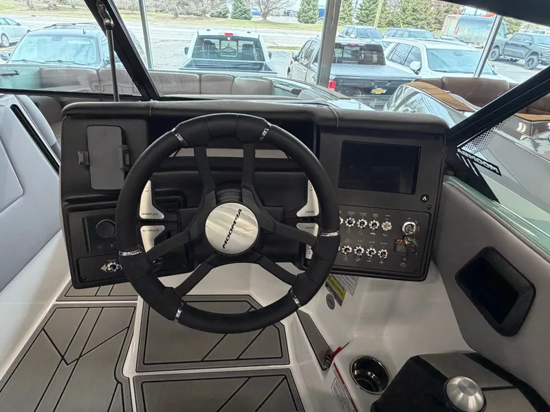 Slide: The Image of The image shows the helm of a 2026 Moomba Tykon with modern controls and a display. - 14