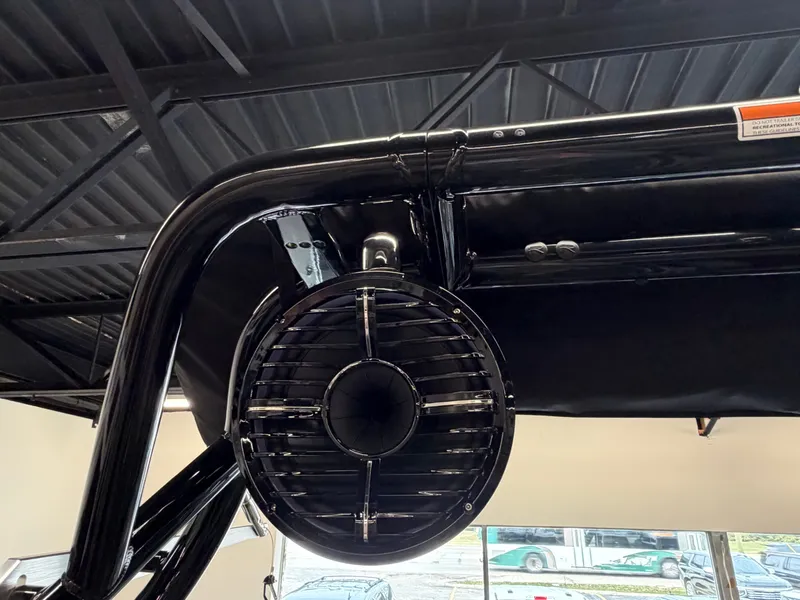 Slide: The Image of Close-up of a speaker on a black boat roof. - 13