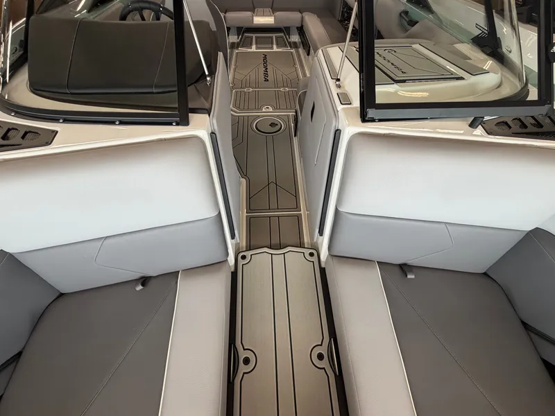 Slide: The Image of Interior of a 2026 Moomba Tykon with gray upholstery and modern flooring. - 17