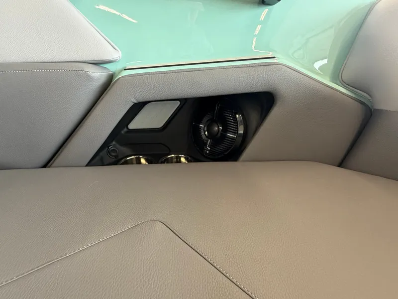 Slide: The Image of Close-up of a modern boat seat with a vent and cup holders. - 25