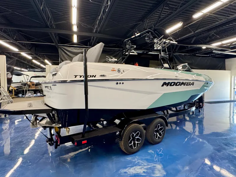 The Image of A 2026 Moomba Tykon boat on a trailer in a showroom. - 0