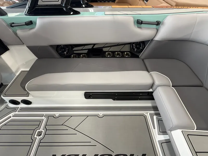 Slide: The Image of Interior of a 2026 Moomba Tykon with gray and white upholstery and modern speakers. - 22