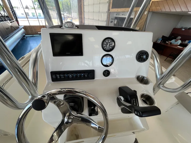 Slide: The Image of The image shows the helm of a Key West 189 FS boat with modern instruments and controls. - 2
