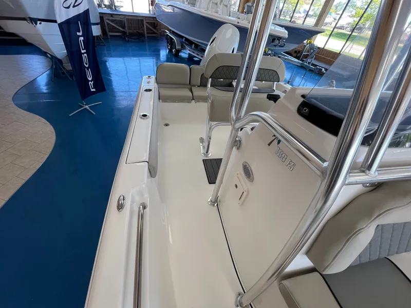 Slide: The Image of The image shows the cockpit of a 2026 Key West 189 FS boat with gray seating. - 7