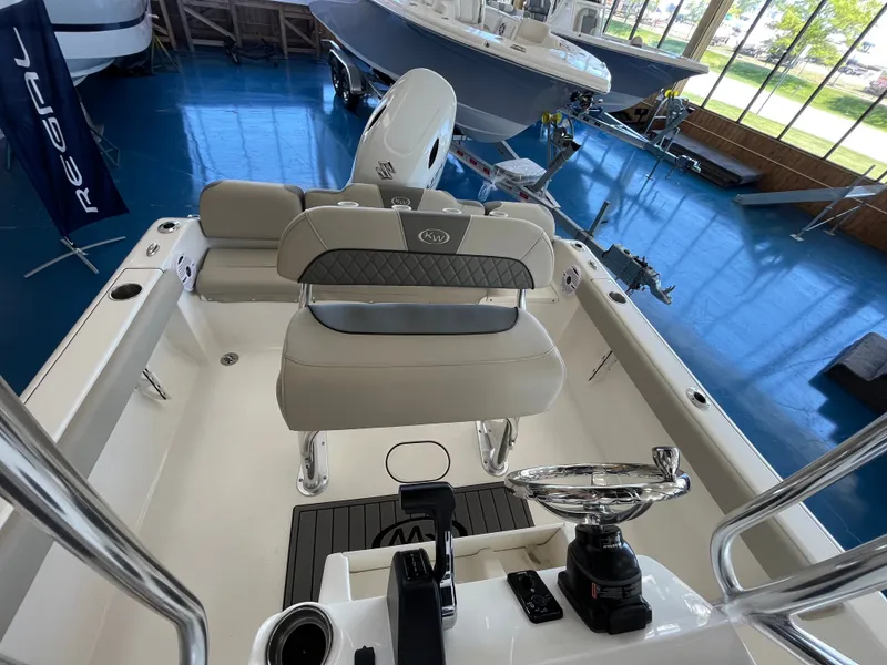 Slide: The Image of Interior view of a Key West 189 FS boat with gray seating and a helm console. - 4