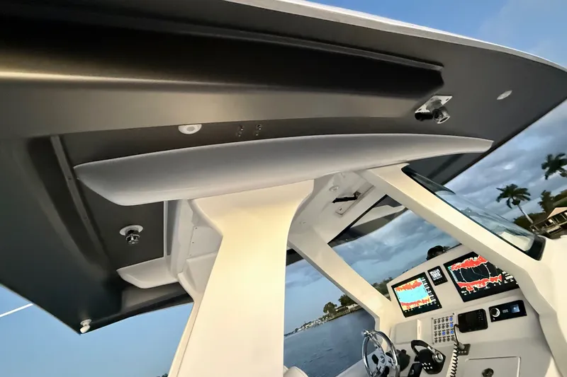 Slide: The Image of Intrepid 345 Nomad SE 2020 helm with advanced navigation displays and sleek design. - 16