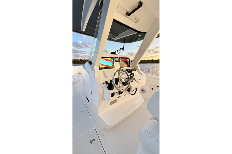 Slide: The Image of 2020 Intrepid 345 Nomad SE helm with dual displays and steering wheel. - 33