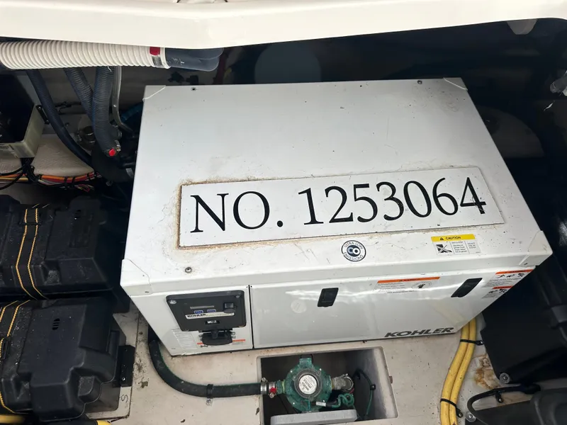 Slide: The Image of A Kohler generator in the engine room of a 2012 Meridian 341 Sedan. - 34
