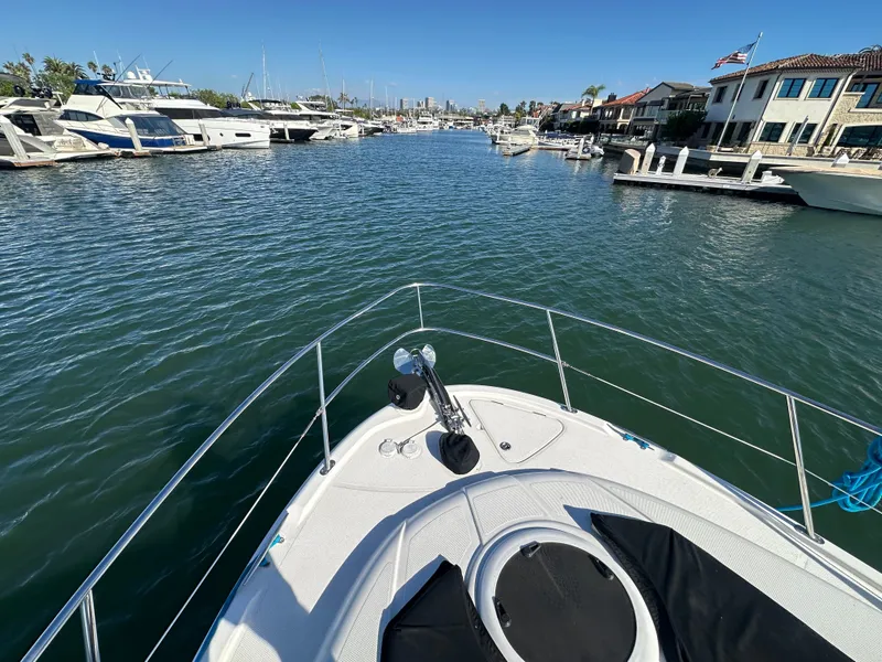 Slide: The Image of View from the bow of a Meridian 341 Sedan overlooking a marina with several boats. - 29