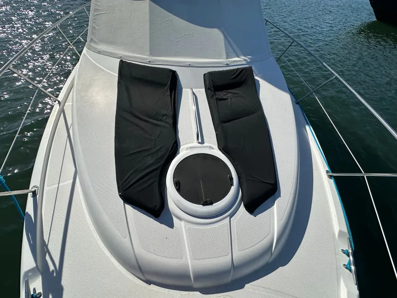 Slide: The Image of The deck of the 2012 Meridian 341 Sedan with black lounging cushions. - 31