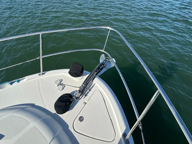 Slide: The Image of Bow view of a 2012 Meridian 341 Sedan on calm water. - 28