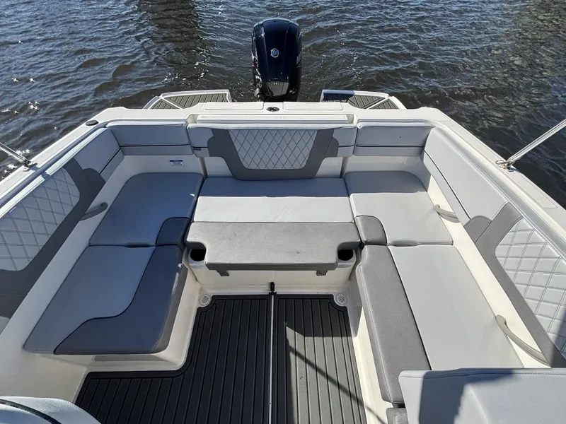 Slide: The Image of The image shows the spacious cockpit of a 2025 Bayliner VR4 Bowrider OB with gray upholstery. - 17