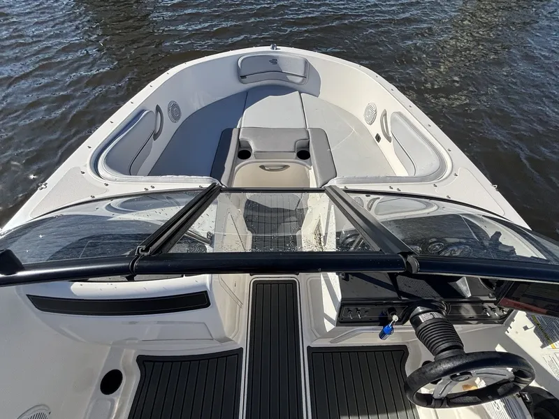 Slide: The Image of The image shows the cockpit of a 2025 Bayliner VR4 Bowrider OB on the water. - 9