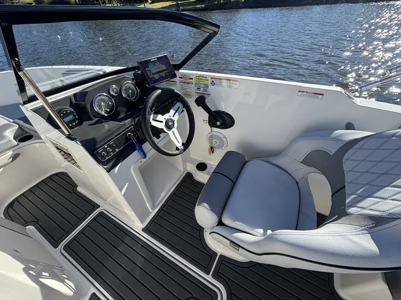Slide: The Image of The image shows the cockpit of a 2025 Bayliner VR4 Bowrider OB with a sleek helm. - 11