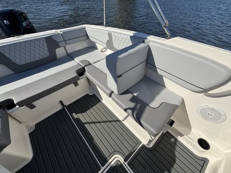 Slide: The Image of The image shows the cockpit of a 2025 Bayliner VR4 Bowrider OB with gray upholstery. - 15