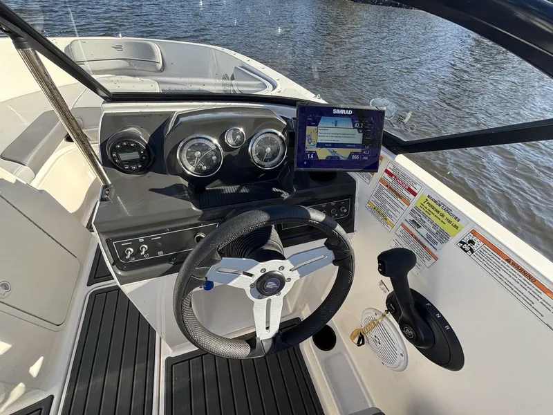 Slide: The Image of The image shows the cockpit of a 2025 Bayliner VR4 Bowrider OB with modern instruments. - 13