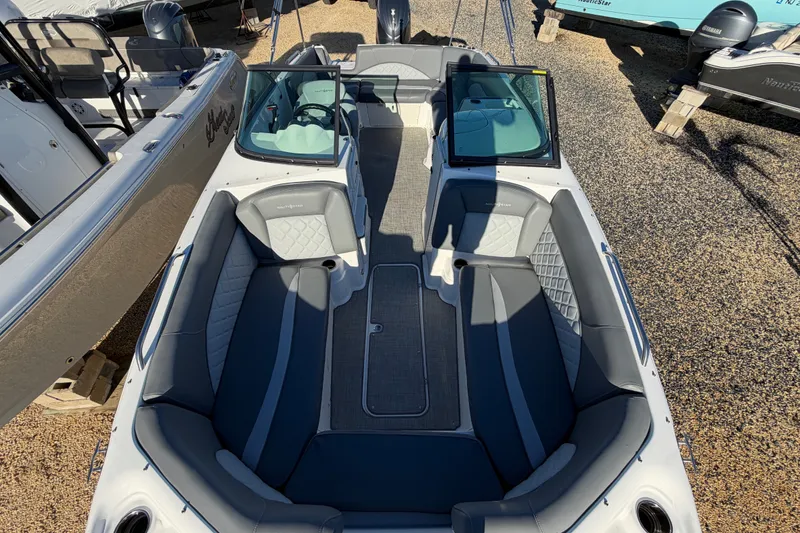 Slide: The Image of 2024 NauticStar 223 DC Deck boat interior with spacious seating and modern design. - 20