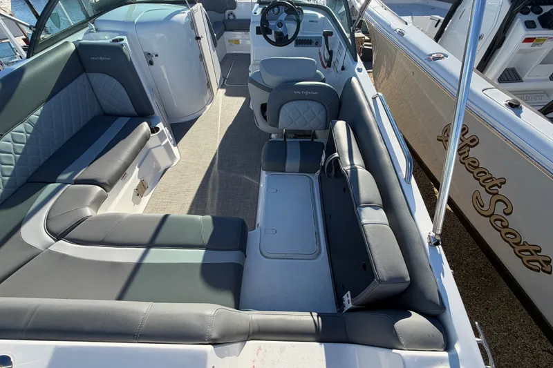 Slide: The Image of 2024 NauticStar 223 DC Deck boat interior with spacious seating and modern design. - 9