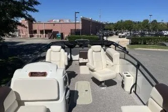 Slide: The Image of 2024 Palm Beach 23 HPT pontoon boat with spacious seating and modern design. - 4