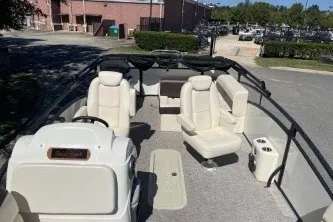Slide: The Image of 2024 Palm Beach 23 HPT pontoon boat with spacious seating and modern design. - 6