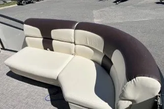 Slide: The Image of 2024 Palm Beach 23 HPT boat seating, featuring a curved, two-tone design in a sunny outdoor setting. - 5