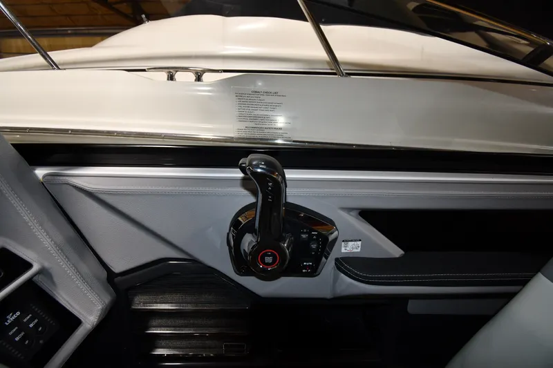 Slide: The Image of 2024 Cobalt A29 boat interior with control panel and throttle lever. - 11