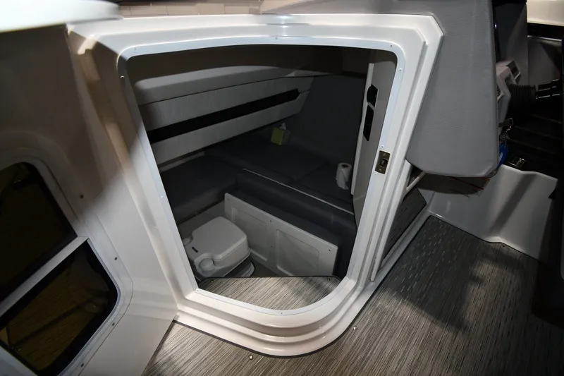 Slide: The Image of Interior cabin of 2024 Cobalt A29 boat, featuring seating and compact amenities. - 28
