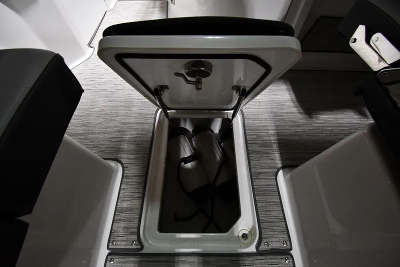 Slide: The Image of 2024 Cobalt A29 boat storage compartment with life jackets inside. - 27