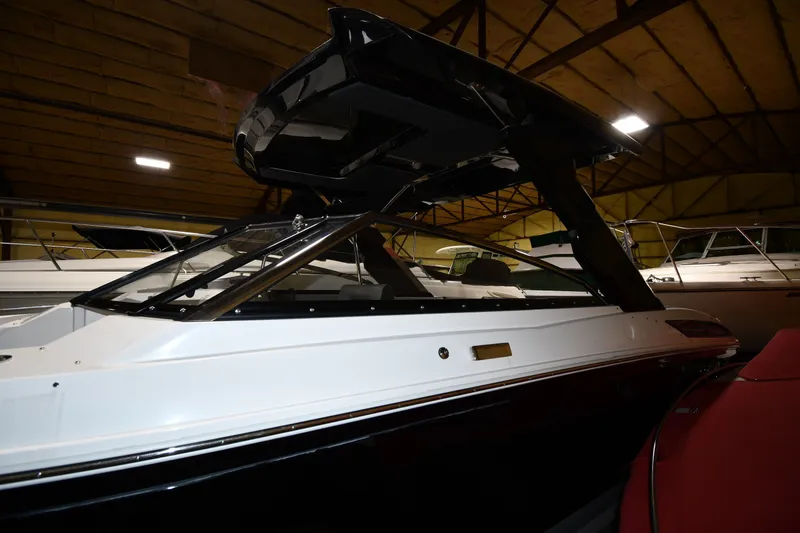 Slide: The Image of 2024 Cobalt A29 boat in showroom, featuring sleek design and modern architecture. - 2