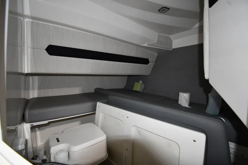 Slide: The Image of 2024 Cobalt A29 cabin interior with seating and compact toilet. - 29