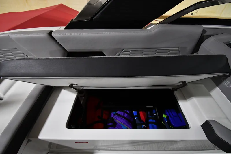 Slide: The Image of 2024 Cobalt A29 boat storage compartment with life jackets inside. - 20