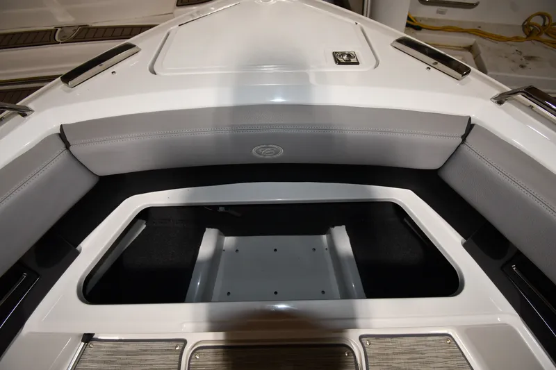Slide: The Image of 2024 Cobalt A29 boat interior with sleek seating and storage compartment. - 26