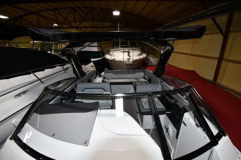 Slide: The Image of 2024 Cobalt A29 boat interior in a showroom, showcasing sleek design and modern features. - 7
