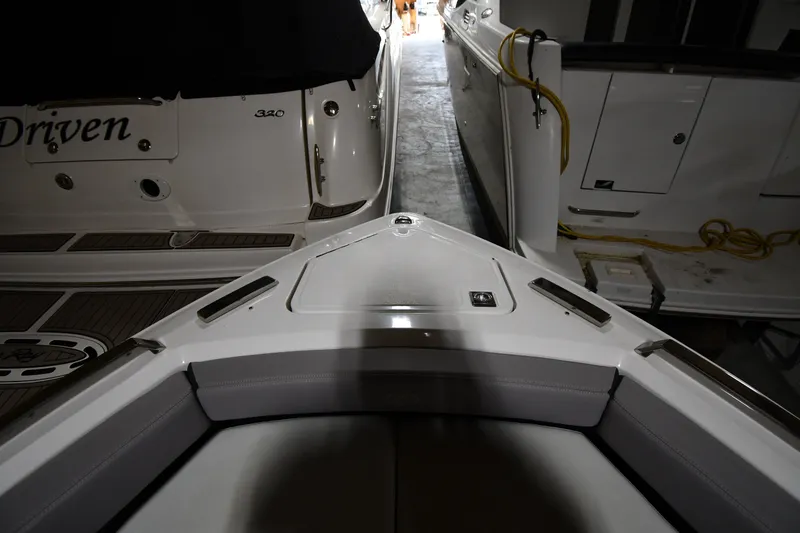 Slide: The Image of 2024 Cobalt A29 boat interior in a dimly lit storage area. - 4