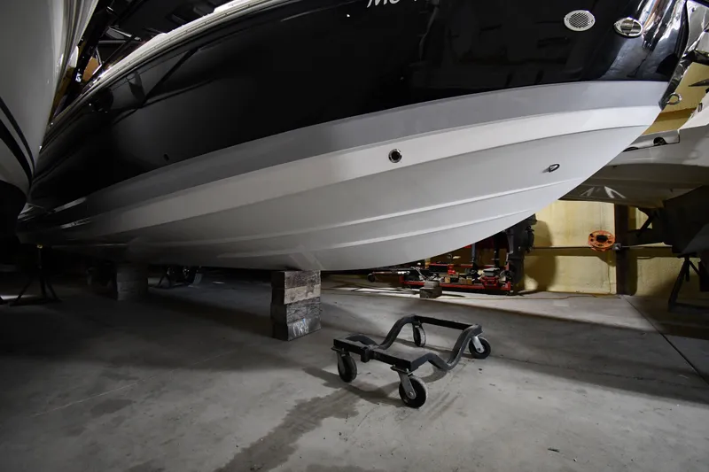 Slide: The Image of 2024 Cobalt A29 boat hull in storage, showcasing sleek design and craftsmanship. - 33