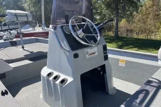 Slide: The Image of 2015 G3 1756 CC boat console with steering wheel, outdoors in sunlight. - 7