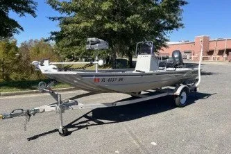 Slide: The Image of 2015 G3 1756 CC boat on trailer in parking lot. - 1