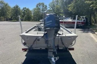 Slide: The Image of 2015 G3 1756 CC boat with Yamaha outboard motor in a parking lot. - 5
