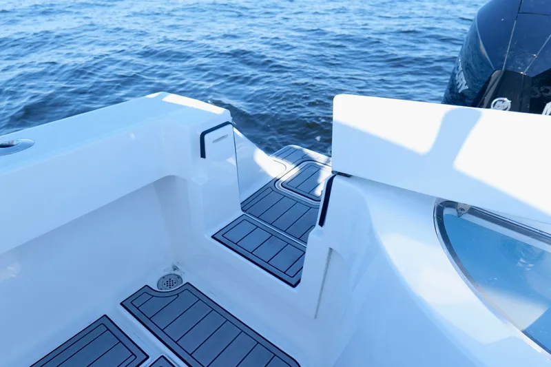 Slide: The Image of 2024 Onslow Bay 27 Offshore Edition boat deck with ocean backdrop. - 27