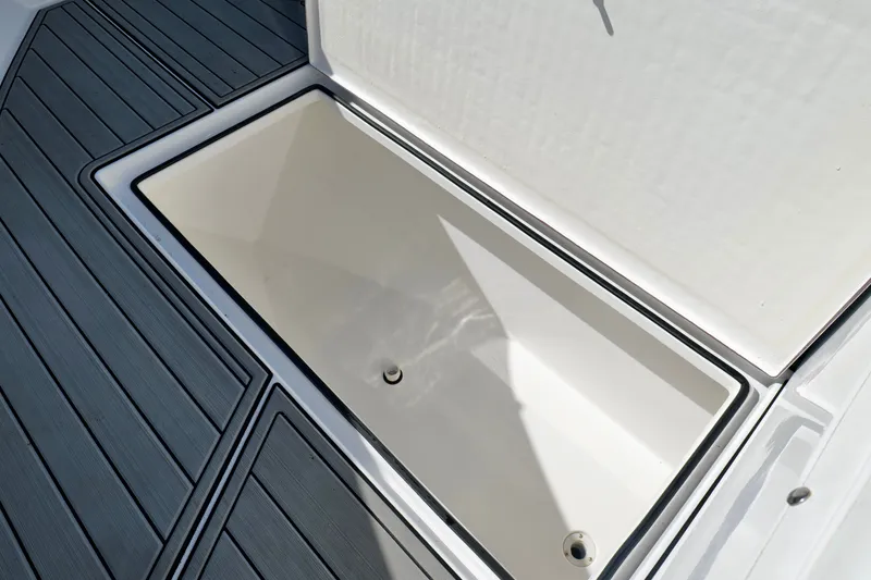 Slide: The Image of 2024 Onslow Bay 27 Offshore Edition boat storage compartment with sleek design and durable flooring. - 34