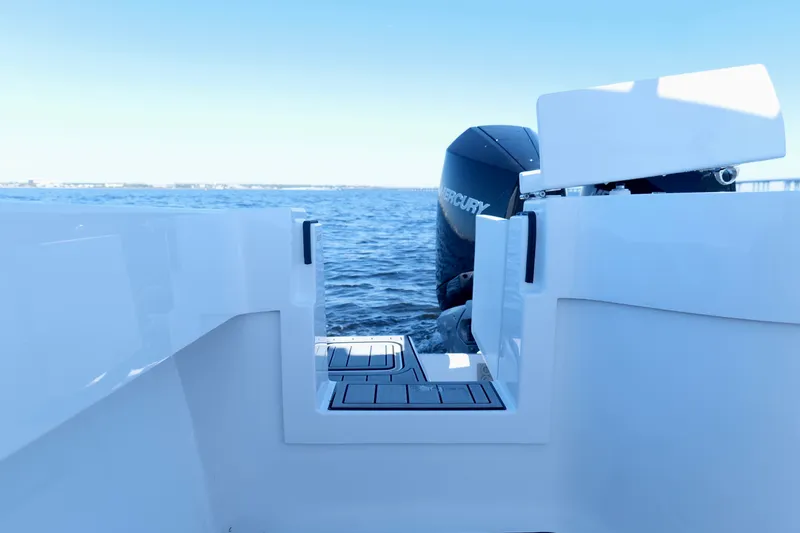 Slide: The Image of 2024 Onslow Bay 27 Offshore Edition boat with Mercury engine on open water. - 26