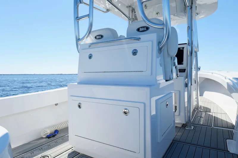 Slide: The Image of 2024 Onslow Bay 27 Offshore Edition boat interior with sleek design and ocean view. - 24