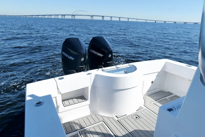 Slide: The Image of 2024 Onslow Bay 27 Offshore Edition boat with dual Mercury engines on open water. - 19