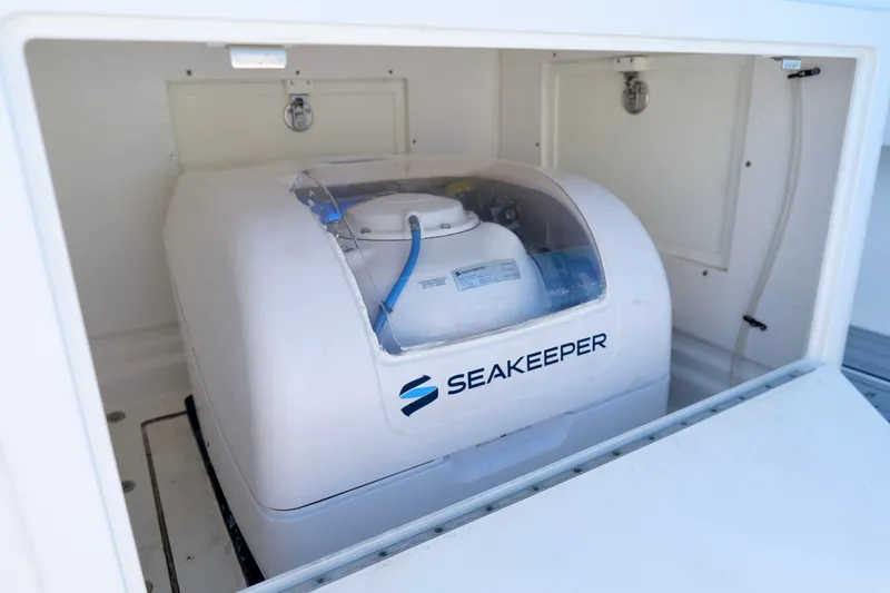 Slide: The Image of Seakeeper gyroscope installed in 2024 Onslow Bay 27 Offshore Edition boat compartment. - 25