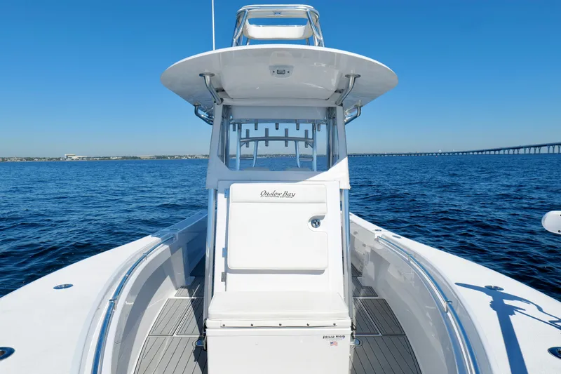 Slide: The Image of 2024 Onslow Bay 27 Offshore Edition boat on open water, clear blue sky. - 40