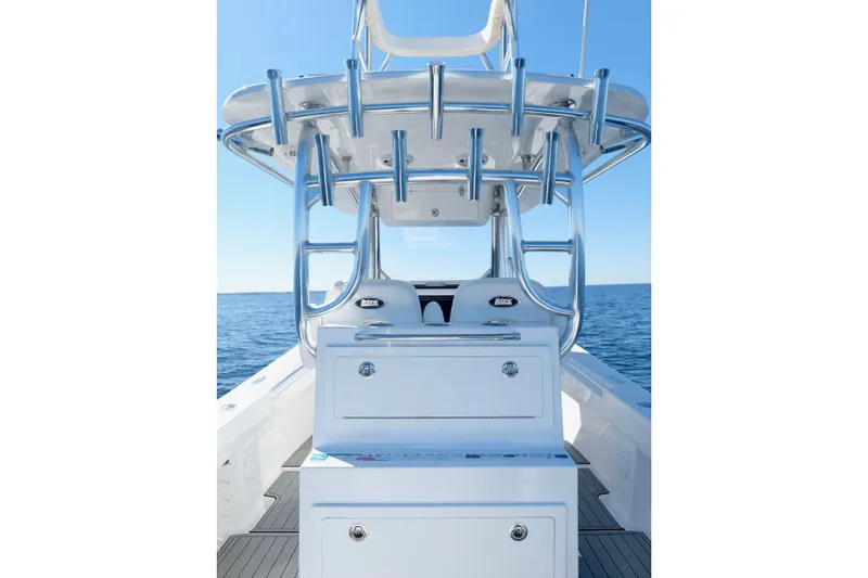 Slide: The Image of 2024 Onslow Bay 27 Offshore Edition boat interior with rod holders and seating. - 23