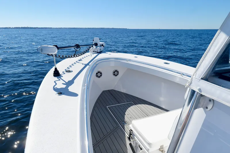 Slide: The Image of 2024 Onslow Bay 27 Offshore Edition boat on open water, showcasing deck and railing. - 33